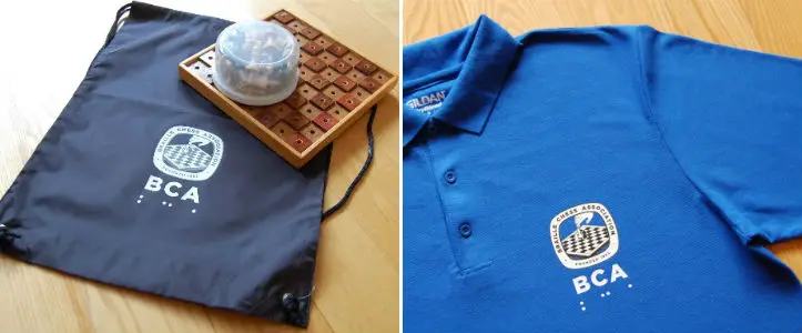 Polo shirts and tote bags with the BCA logo.