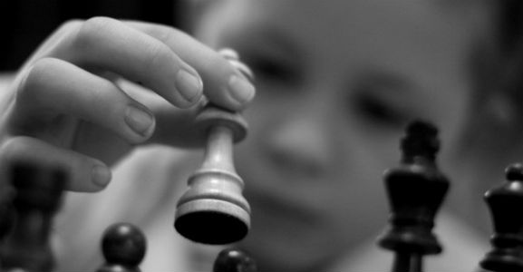 A Kid Playing Chess Black&White